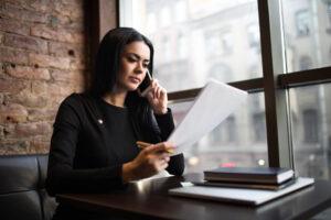A personal injury attorney calls her client and provides them with information about the Death on High Seas Act.